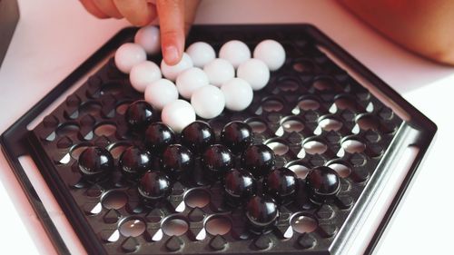 High angle view of hand holding candies