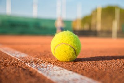 Close-up of tennis ball on field