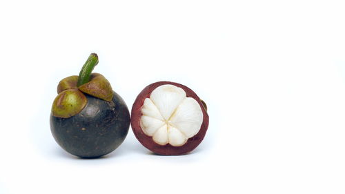 Close-up of fruits against white background
