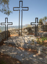 Cross in temple against clear sky