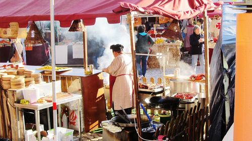 Woman standing at market stall