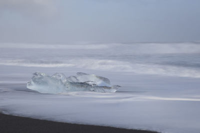 Scenic view of frozen sea against sky