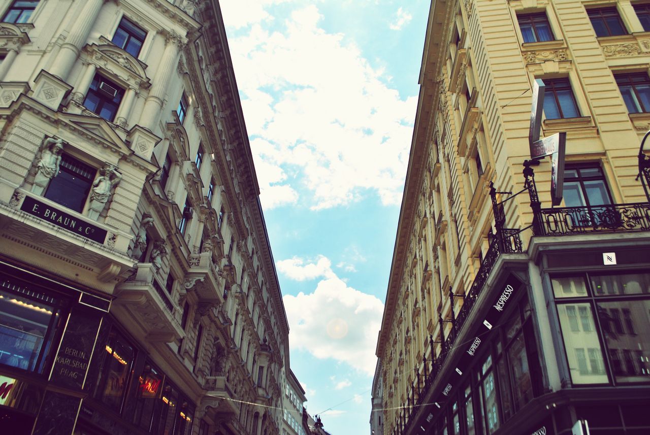 architecture, building exterior, built structure, low angle view, cloud - sky, sky, city, building, day, no people, nature, window, residential district, outdoors, lighting equipment, old, street, city life, history, wall - building feature