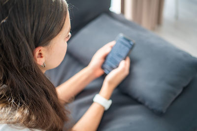 Young woman using mobile phone