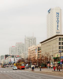 City street and buildings against sky