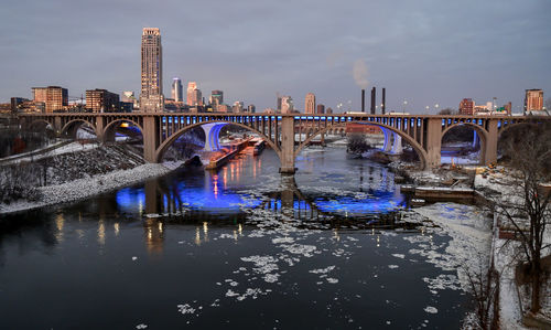 Downtown winter skyline along the river at sunrise