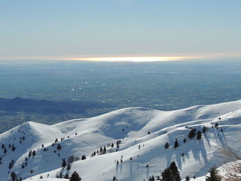 Scenic view of snow covered landscape against sky