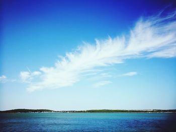 Scenic view of sea against blue sky