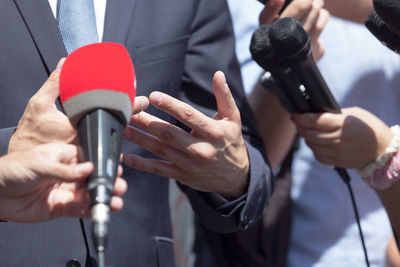 Close-up of people holding hands