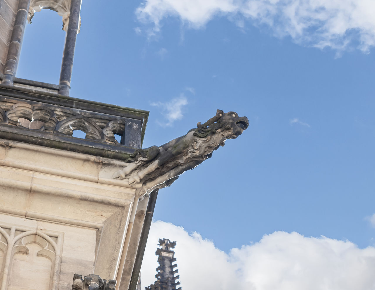 sky, architecture, cloud, landmark, built structure, history, the past, travel destinations, low angle view, sculpture, monument, nature, building exterior, city, travel, statue, day, blue, no people, tourism, craft, outdoors, representation, religion, memorial, architectural column, building, stone material, human representation, old