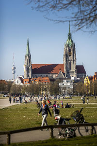 Group of people in front of buildings in city