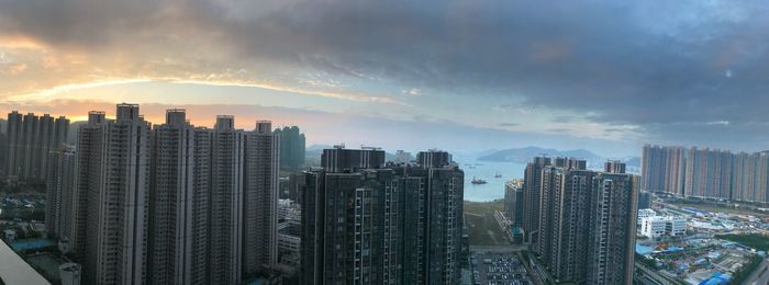 Panoramic view of buildings against sky during sunset