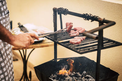 Cropped hand of man preparing food