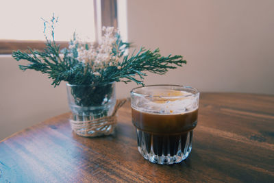 Close-up of coffee in glass on table