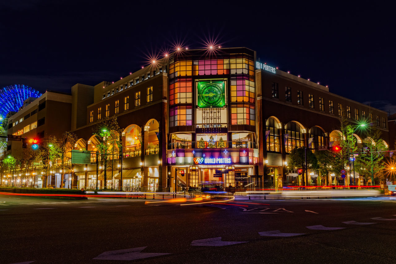 illuminated, night, building exterior, architecture, built structure, city, street, motion, road, transportation, blurred motion, sign, sky, long exposure, no people, city street, city life, nature, light trail, travel destinations, outdoors, light