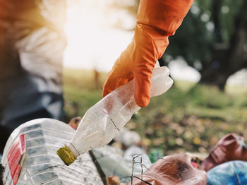 Close-up of hand holding bottle