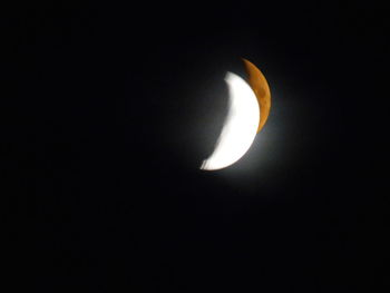 Low angle view of moon against sky at night