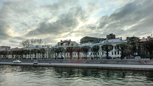 View of buildings against cloudy sky