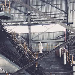 Staircase at railroad station against sky