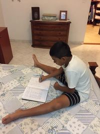 Woman sitting on book