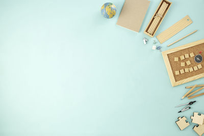 High angle view of paper lamp against blue background