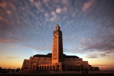 Low angle view of illuminated mosque hassan ii