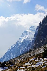 Scenic view of snowcapped mountains against sky