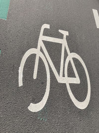 High angle view of road sign on street