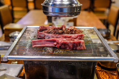 Close-up of meat on barbecue grill