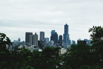 Buildings in city against sky