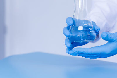 Cropped hand holding dental equipment
