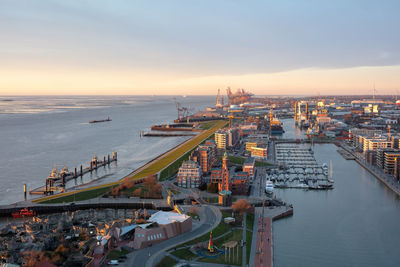 High angle view of bridge over sea against sky during sunset