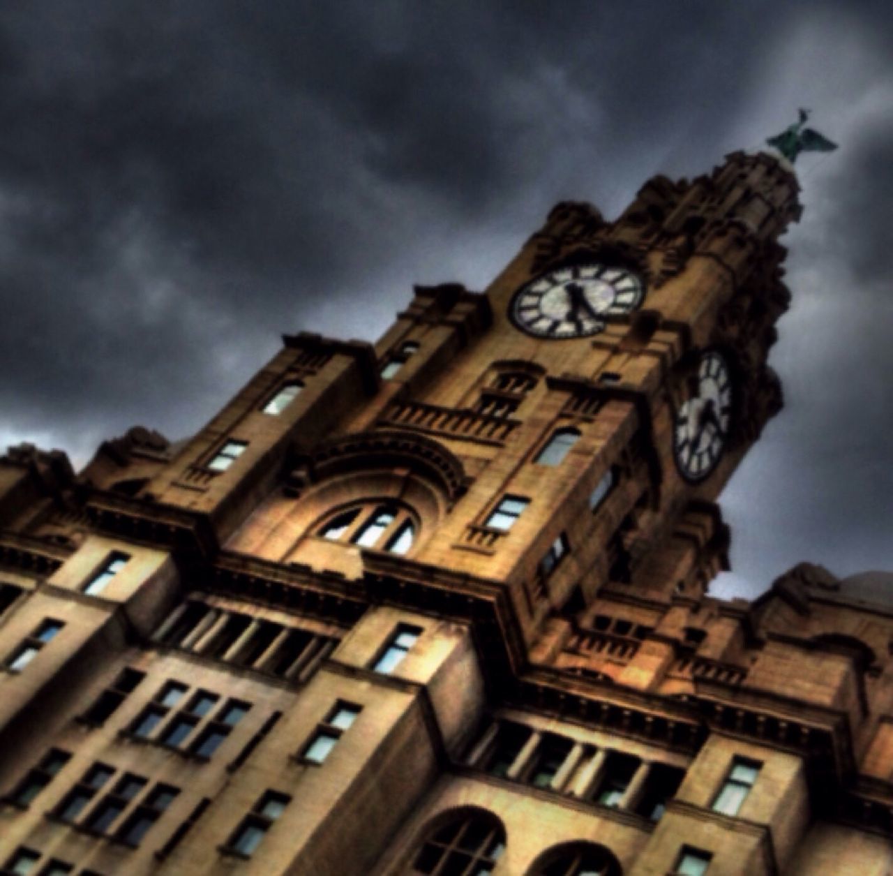 low angle view, architecture, building exterior, built structure, sky, religion, place of worship, cloud - sky, church, spirituality, history, cathedral, cloudy, travel destinations, famous place, cloud, outdoors, clock tower