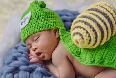 Close-up of baby girl with hat