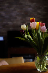 Close-up of tulips in vase on table