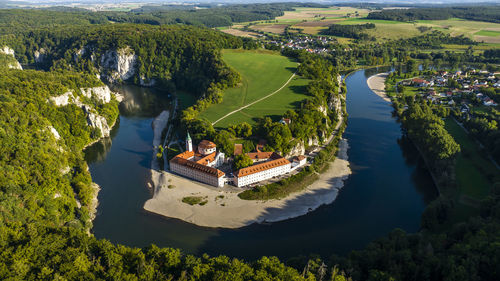 Germany, bavaria, kelheim, aerial view of weltenburg abbey and surrounding landscape in summer