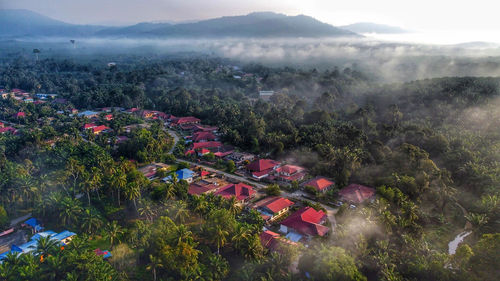 High angle view of townscape against mountain