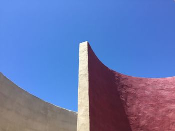 Low angle view of building against blue sky