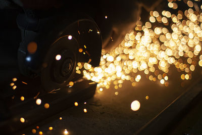 Close-up of grinder emitting sparks