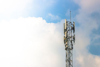 Low angle view of communications tower against sky