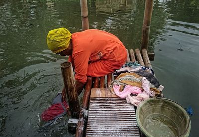 High angle view of man working in lake