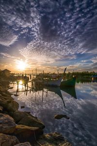 Scenic view of lake against sky during sunset