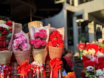 Close-up of red flowers for sale at market stall