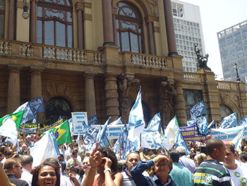 Group of people at flags in city