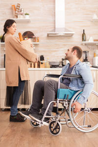 Side view of a smiling young couple