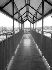 Empty footpath along bridge