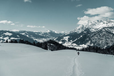 Scenic view of snowcapped mountains against sky