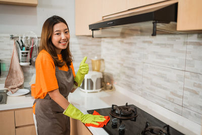 Portrait of young woman working in office