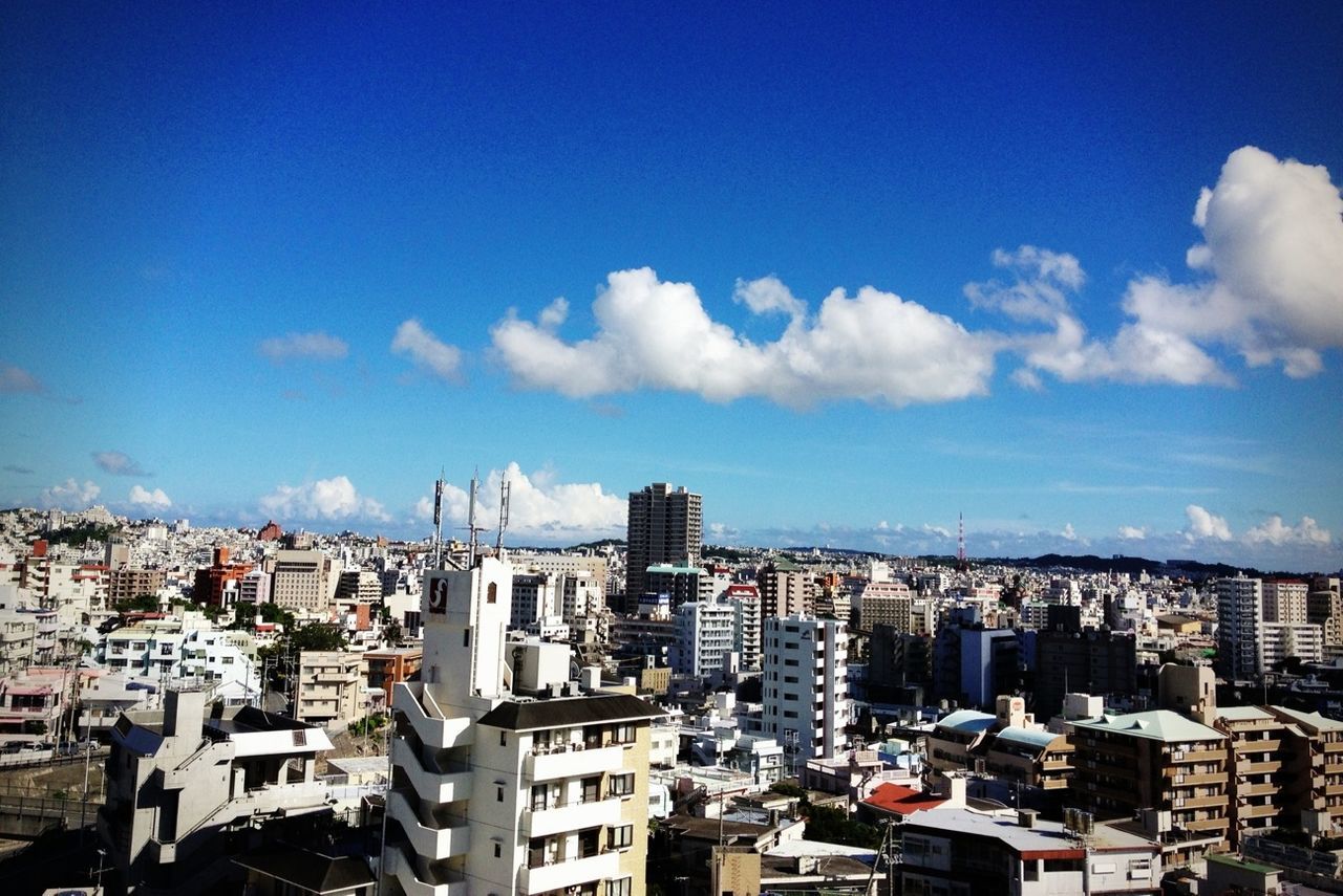 cityscape, building exterior, city, architecture, built structure, crowded, sky, skyscraper, residential district, high angle view, blue, tower, residential building, tall - high, residential structure, cloud - sky, city life, modern, cloud, office building