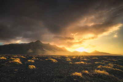 Scenic view of landscape against sky during sunset